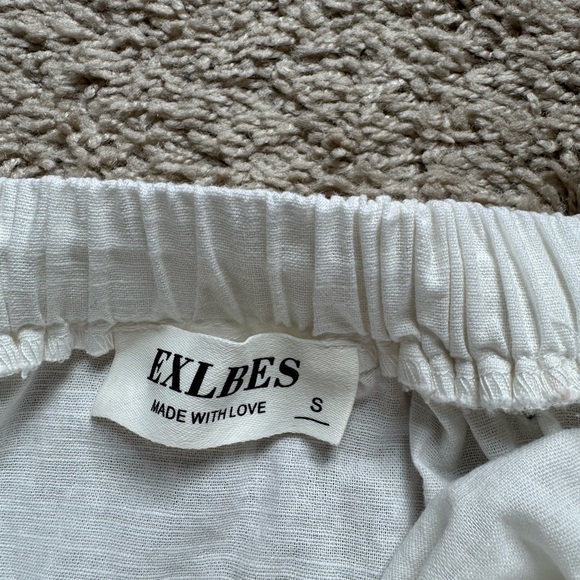 Elegant White Backless Dress - Picture 3 of 7